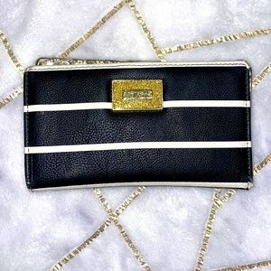 Betsy Johnson wallet. 10 card holder. Black wallet w/ cream stripes. Gold detail